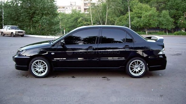 Дискілер OZ Racing Ultraleggera R16 на автомобиле Mitsubishi Lancer [102]
