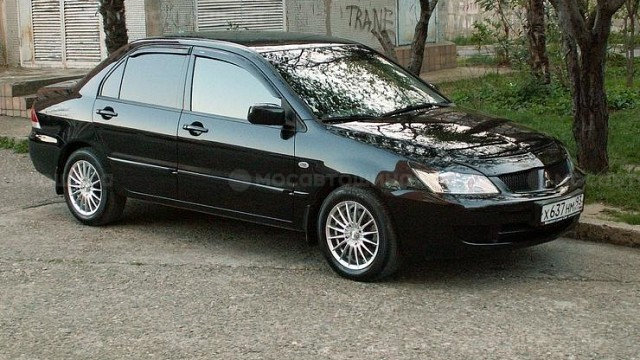Дискілер Racing Wheels Classic H-155 R16 на автомобиле Mitsubishi Lancer [105]